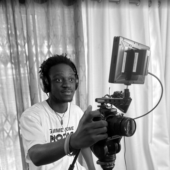Crew member with a camera and monitor setup